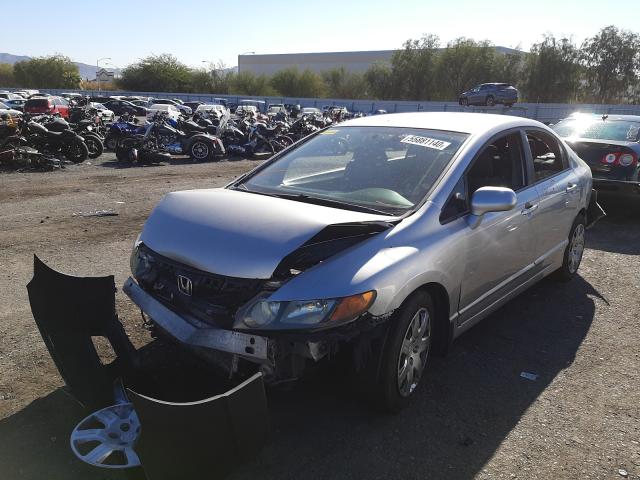 Photo 1 VIN: 19XFA1F51AE075671 - HONDA CIVIC LX 