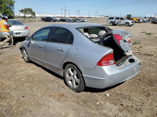 Photo 1 VIN: 19XFA1F54AE030899 - HONDA CIVIC LX 