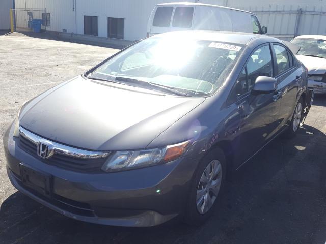 Photo 1 VIN: 19XFB2F52CE333797 - HONDA CIVIC LX 