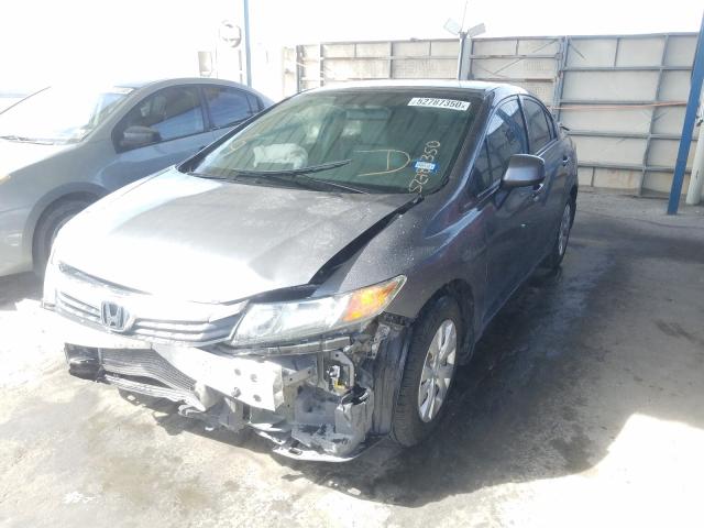 Photo 1 VIN: 19XFB2F53CE305670 - HONDA CIVIC LX 