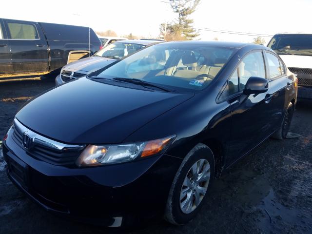 Photo 1 VIN: 19XFB2F54CE328469 - HONDA CIVIC LX 