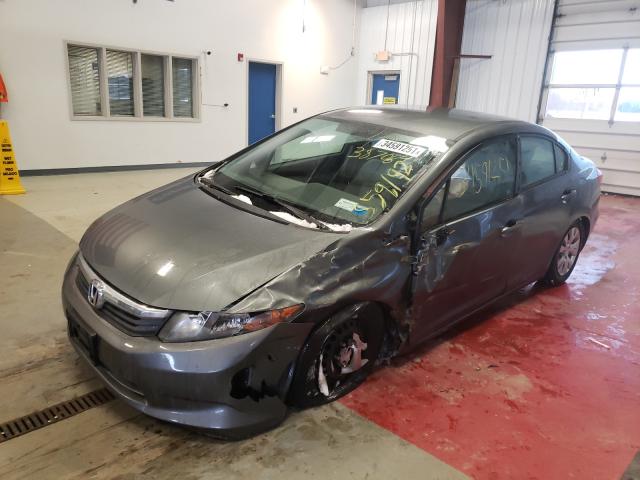 Photo 1 VIN: 19XFB2F54CE387084 - HONDA CIVIC LX 