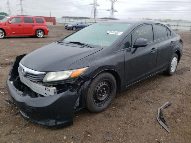 Photo 1 VIN: 19XFB2F55CE070883 - HONDA CIVIC LX 