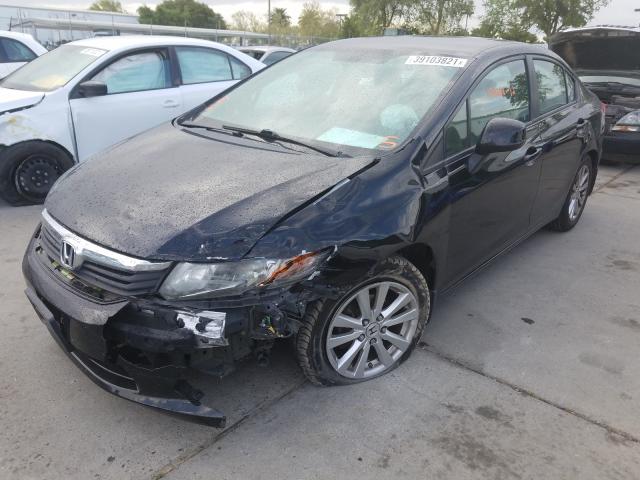 Photo 1 VIN: 19XFB2F56CE385451 - HONDA CIVIC LX 