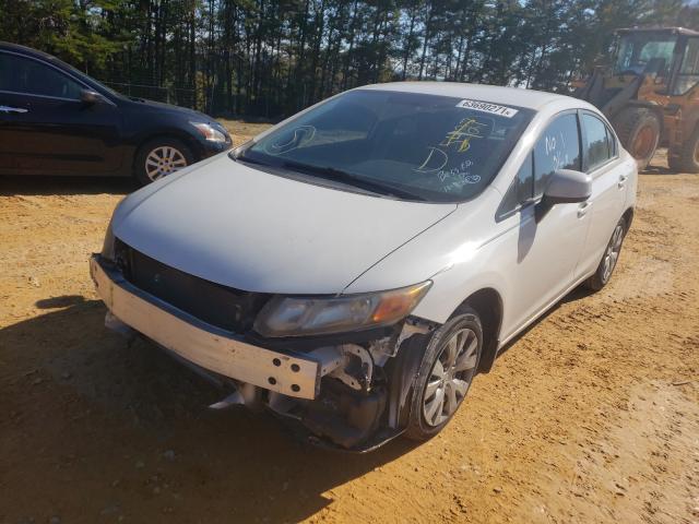 Photo 1 VIN: 19XFB2F57CE099138 - HONDA CIVIC LX 