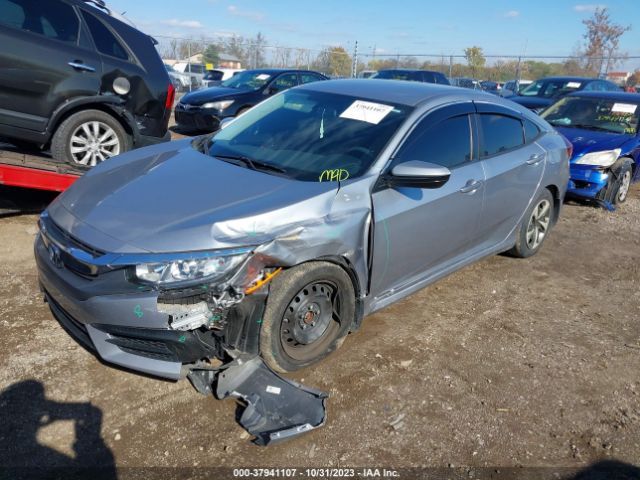 Photo 1 VIN: 19XFC2E57JE001401 - HONDA CIVIC SEDAN 