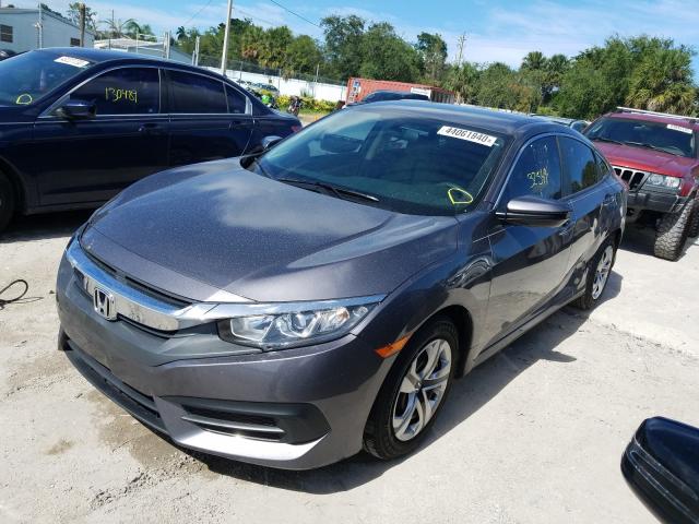 Photo 1 VIN: 19XFC2F55GE037983 - HONDA CIVIC LX 