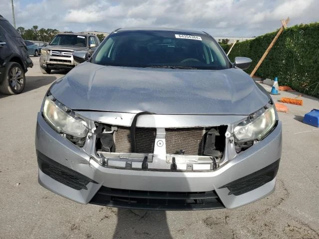 Photo 4 VIN: 19XFC2F5XGE090131 - HONDA CIVIC LX 