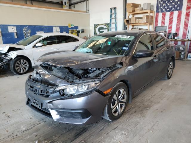 Photo 1 VIN: 19XFC2F5XHE065991 - HONDA CIVIC LX 