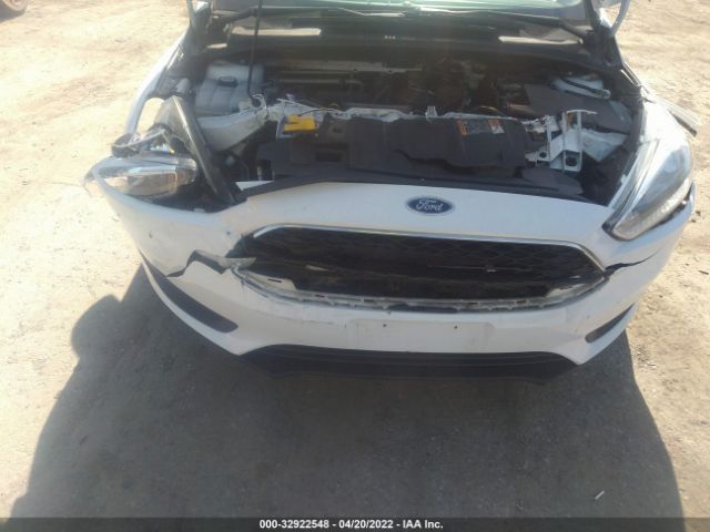 Photo 5 VIN: 1FADP3E24GL311048 - FORD FOCUS 