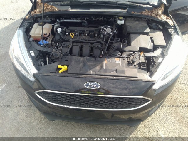 Photo 9 VIN: 1FADP3E25JL208986 - FORD FOCUS 