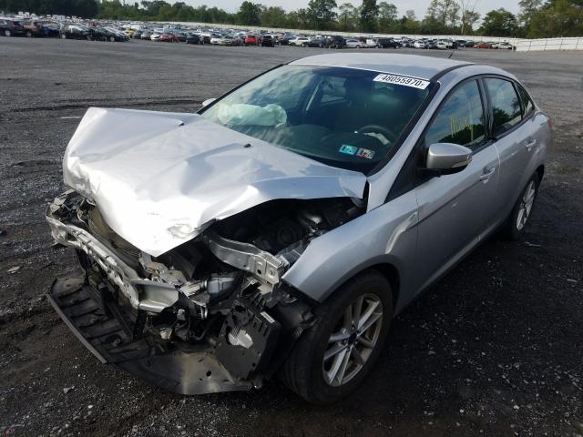 Photo 1 VIN: 1FADP3F20GL270058 - FORD FOCUS SE 