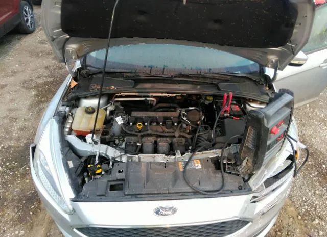 Photo 9 VIN: 1FADP3F20GL283022 - FORD FOCUS 