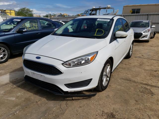 Photo 1 VIN: 1FADP3F20GL337581 - FORD FOCUS SE 