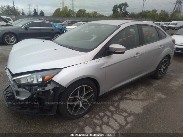 Photo 1 VIN: 1FADP3F20JL221465 - FORD FOCUS 