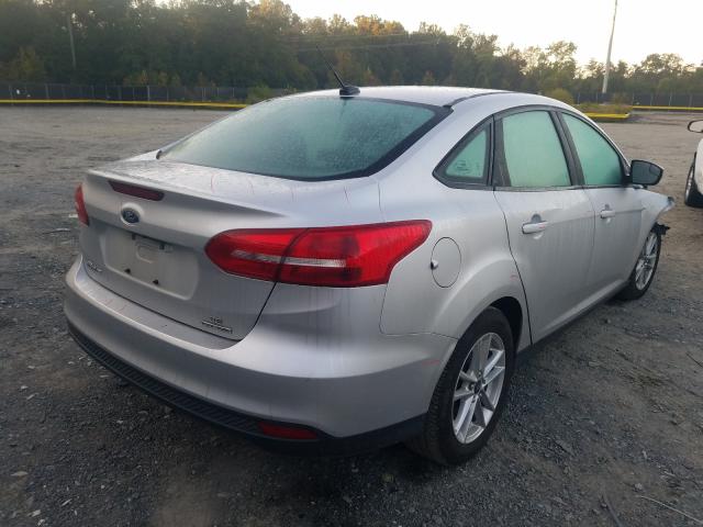 Photo 3 VIN: 1FADP3F21GL230989 - FORD FOCUS SE 