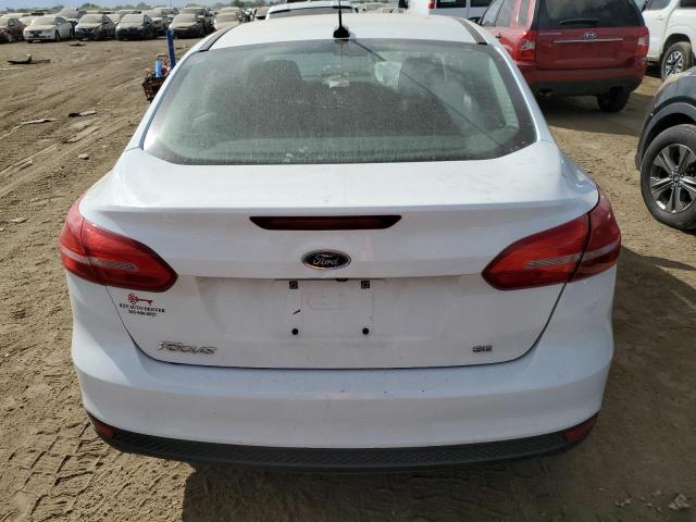 Photo 5 VIN: 1FADP3F21GL365440 - FORD FOCUS SE 