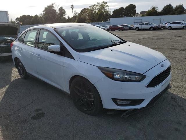 Photo 3 VIN: 1FADP3F21GL388149 - FORD FOCUS SE 