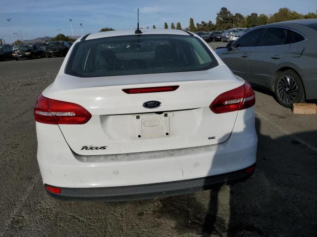 Photo 5 VIN: 1FADP3F21GL388149 - FORD FOCUS SE 