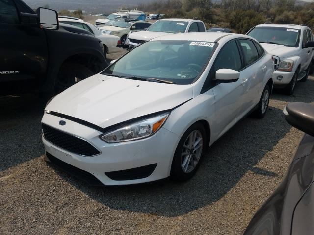 Photo 1 VIN: 1FADP3F22JL205977 - FORD FOCUS SE 