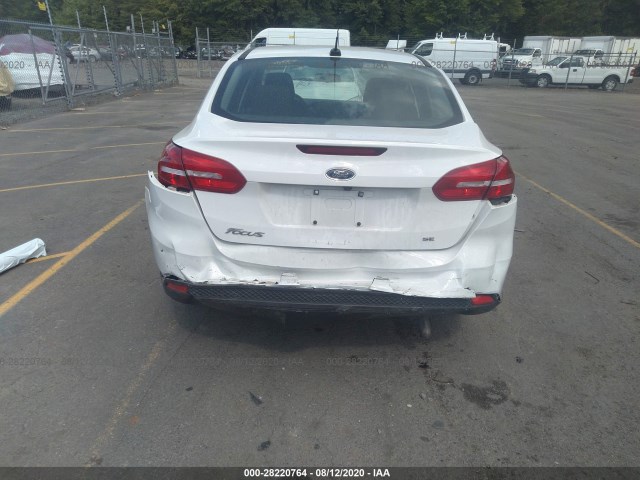 Photo 5 VIN: 1FADP3F22JL272711 - FORD FOCUS 