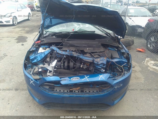 Photo 9 VIN: 1FADP3F22JL295776 - FORD FOCUS 