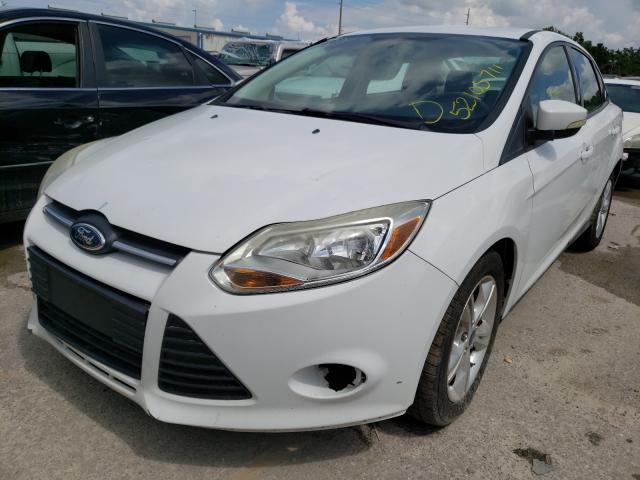 Photo 1 VIN: 1FADP3F23DL312024 - FORD FOCUS SE 