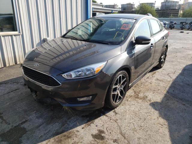 Photo 1 VIN: 1FADP3F23FL384859 - FORD FOCUS SE 