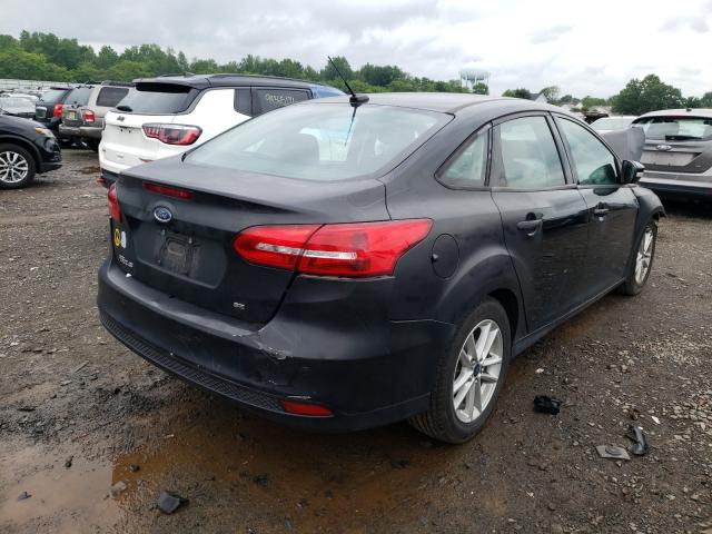 Photo 3 VIN: 1FADP3F23GL240424 - FORD FOCUS SE 