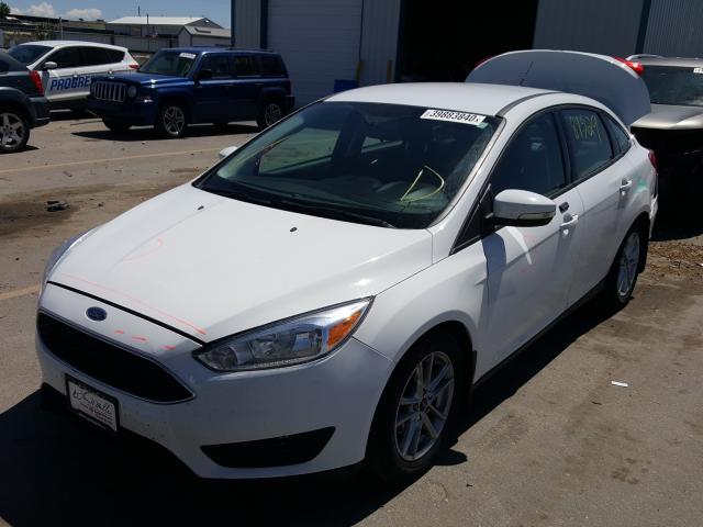 Photo 1 VIN: 1FADP3F23GL282852 - FORD FOCUS SE 