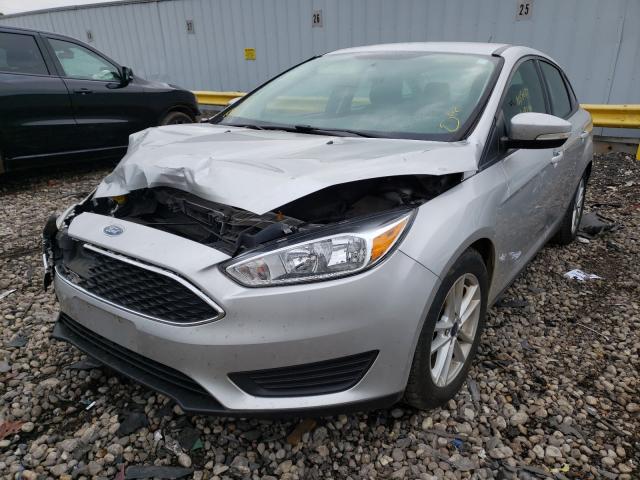 Photo 1 VIN: 1FADP3F23GL305045 - FORD FOCUS SE 