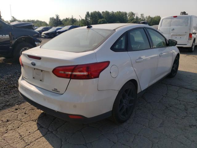 Photo 3 VIN: 1FADP3F23GL331936 - FORD FOCUS SE 