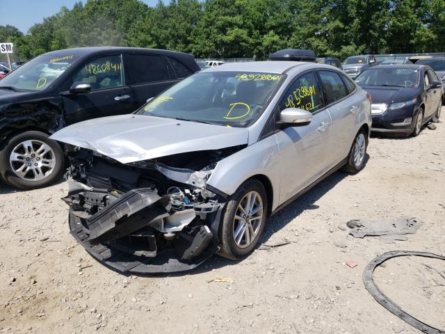 Photo 1 VIN: 1FADP3F23GL338823 - FORD FOCUS SE 