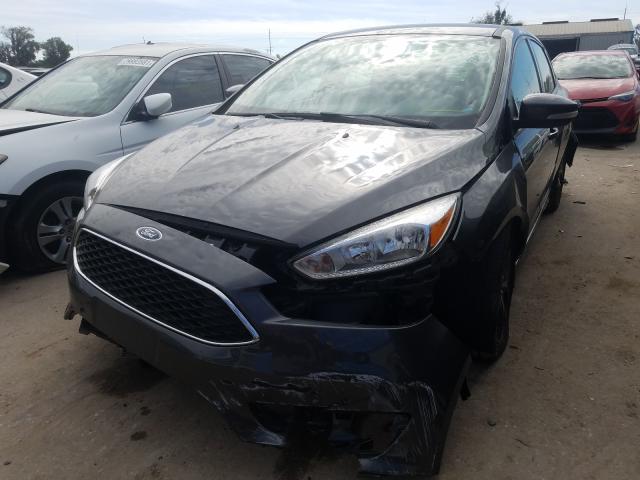 Photo 1 VIN: 1FADP3F23GL389402 - FORD FOCUS SE 