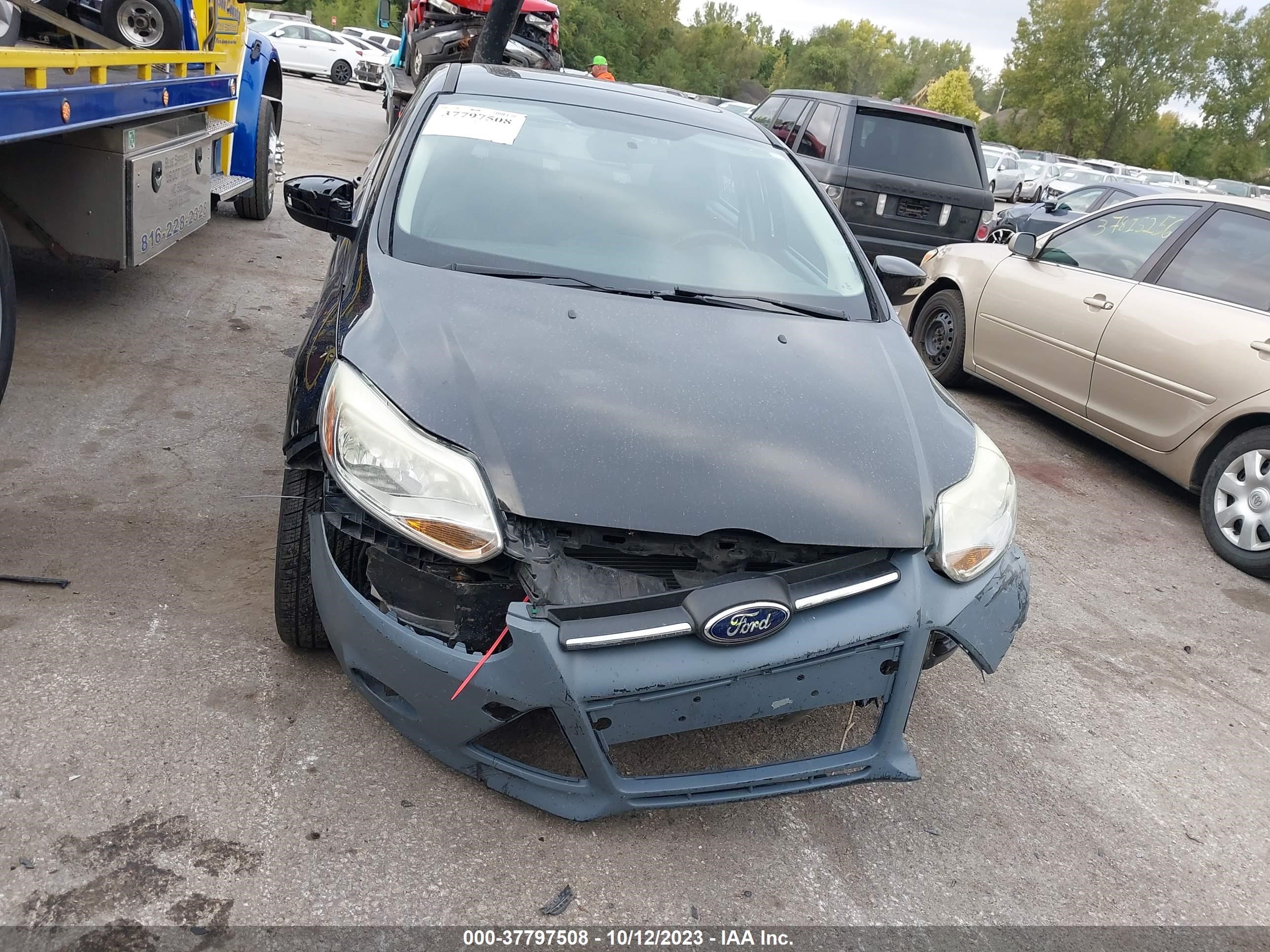 Photo 12 VIN: 1FADP3F24EL150700 - FORD FOCUS 