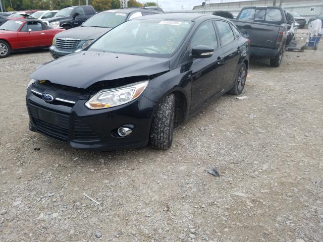 Photo 1 VIN: 1FADP3F24EL167318 - FORD FOCUS SE 