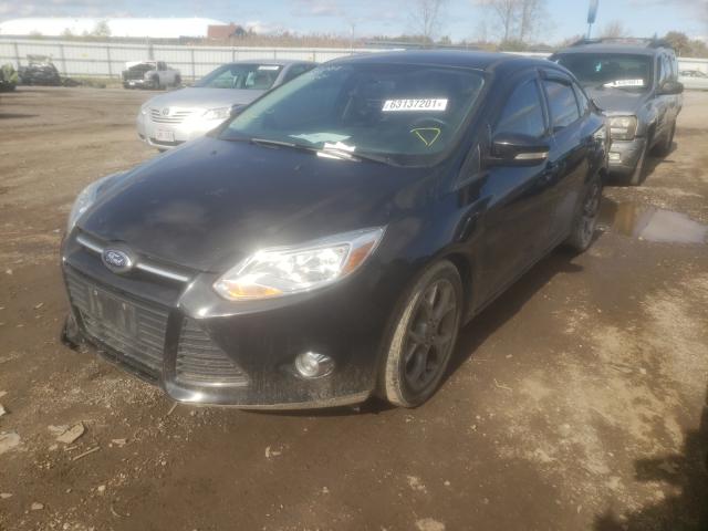 Photo 1 VIN: 1FADP3F24EL411629 - FORD FOCUS SE 