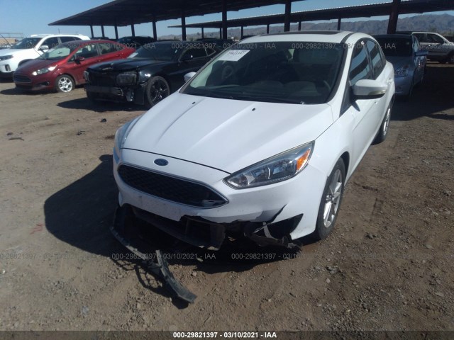 Photo 5 VIN: 1FADP3F24GL272332 - FORD FOCUS 