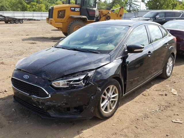 Photo 1 VIN: 1FADP3F24GL305149 - FORD FOCUS SE 