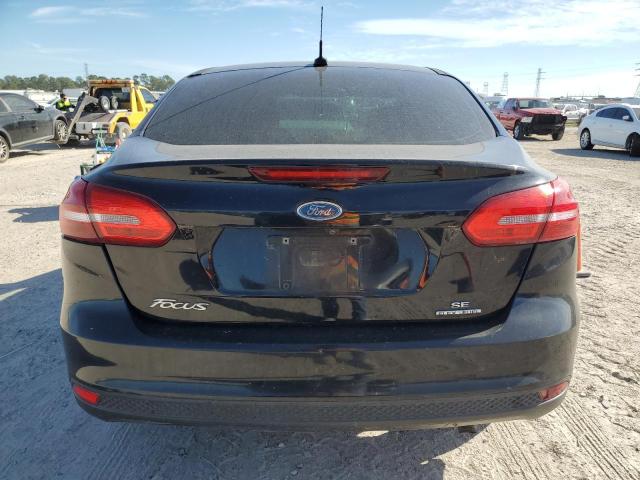 Photo 5 VIN: 1FADP3F24GL309976 - FORD FOCUS SE 