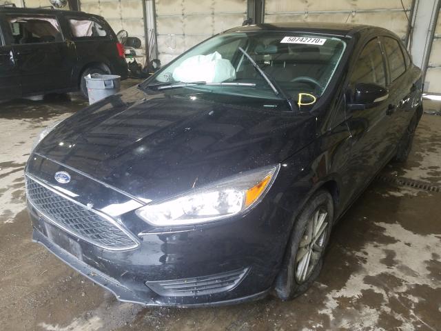 Photo 1 VIN: 1FADP3F24GL344551 - FORD FOCUS SE 