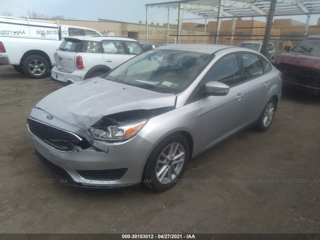 Photo 1 VIN: 1FADP3F24GL377808 - FORD FOCUS 