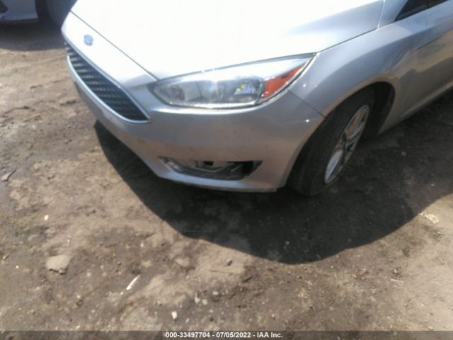 Photo 5 VIN: 1FADP3F24GL385505 - FORD FOCUS 