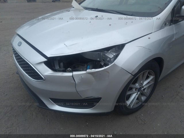 Photo 5 VIN: 1FADP3F24HL240238 - FORD FOCUS 