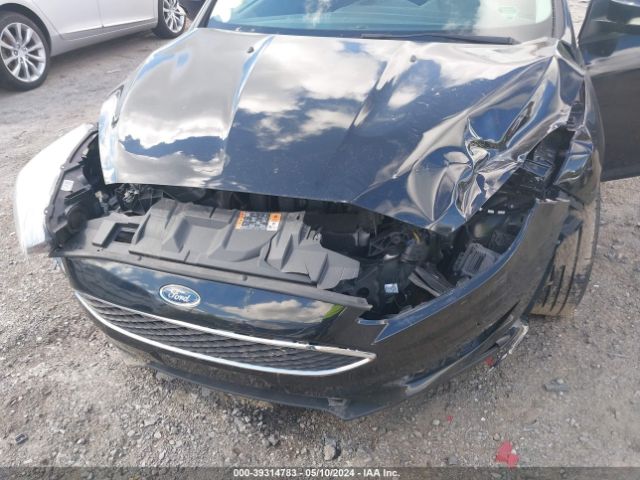 Photo 5 VIN: 1FADP3F24HL308022 - FORD FOCUS 