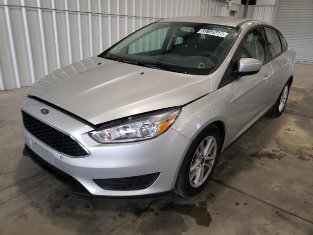 Photo 1 VIN: 1FADP3F24JL303733 - FORD FOCUS SE 