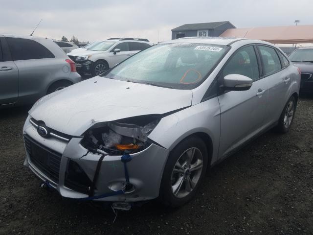 Photo 1 VIN: 1FADP3F25EL242303 - FORD FOCUS SE 