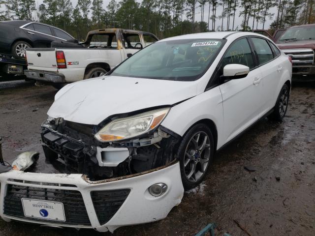 Photo 1 VIN: 1FADP3F25EL330963 - FORD FOCUS SE 