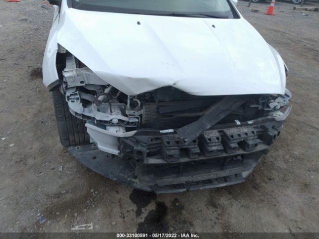 Photo 5 VIN: 1FADP3F25GL228324 - FORD FOCUS 