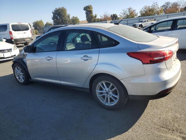 Photo 1 VIN: 1FADP3F25JL327197 - FORD FOCUS SE 